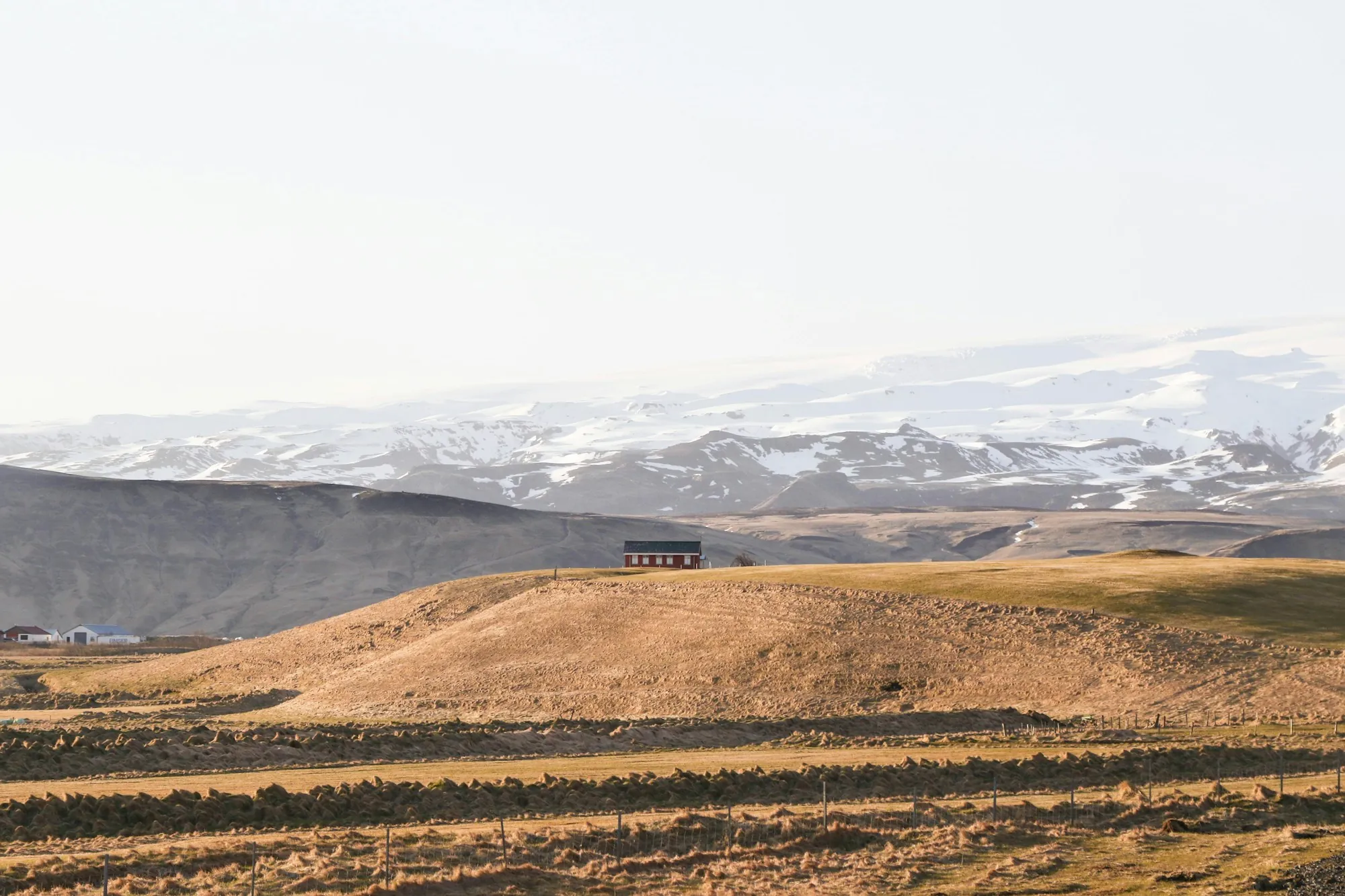 Golden hills and open land with distant mountains