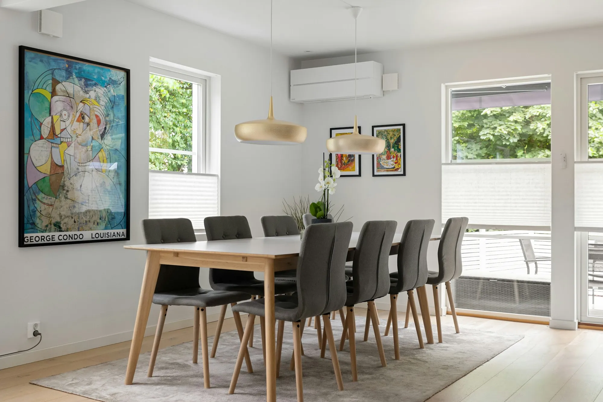 Dining room with a light wood table and colorful wall art, the kind of interior a buyer walks through during a home inspection in Rosamond