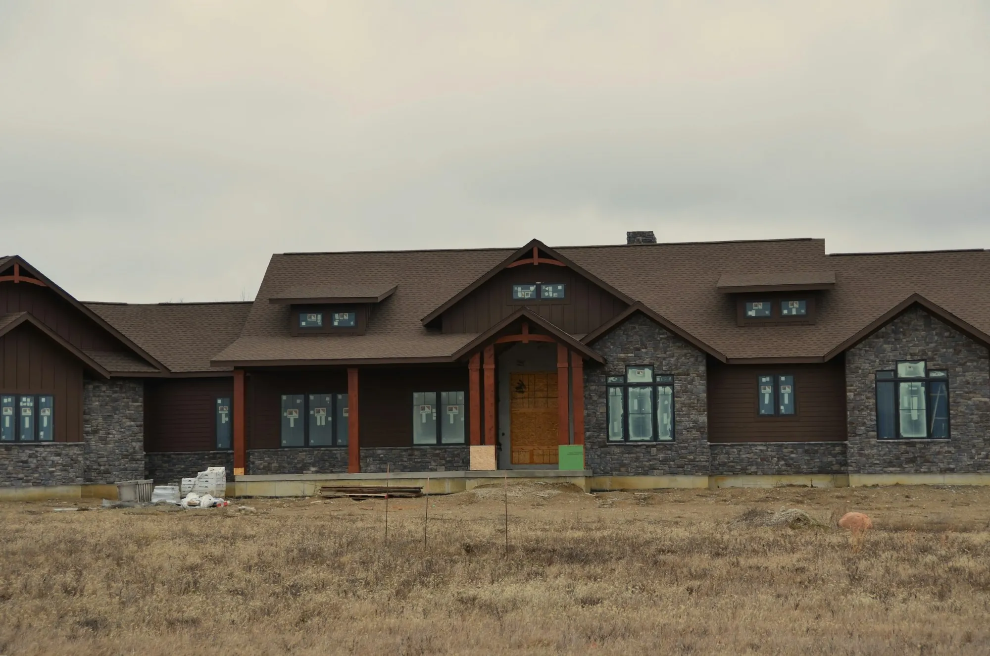 New ranch-style home finished on a fresh dirt lot